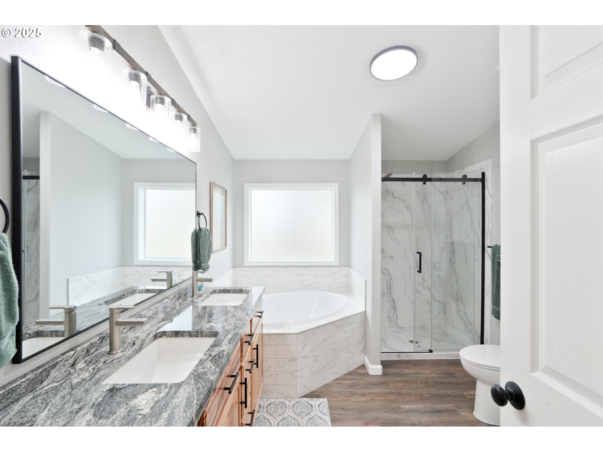 40219 North Dogwood Road Mill City, OR 97360 - Photo 24 of 47 a bathroom with a sink mirror and a bathtub