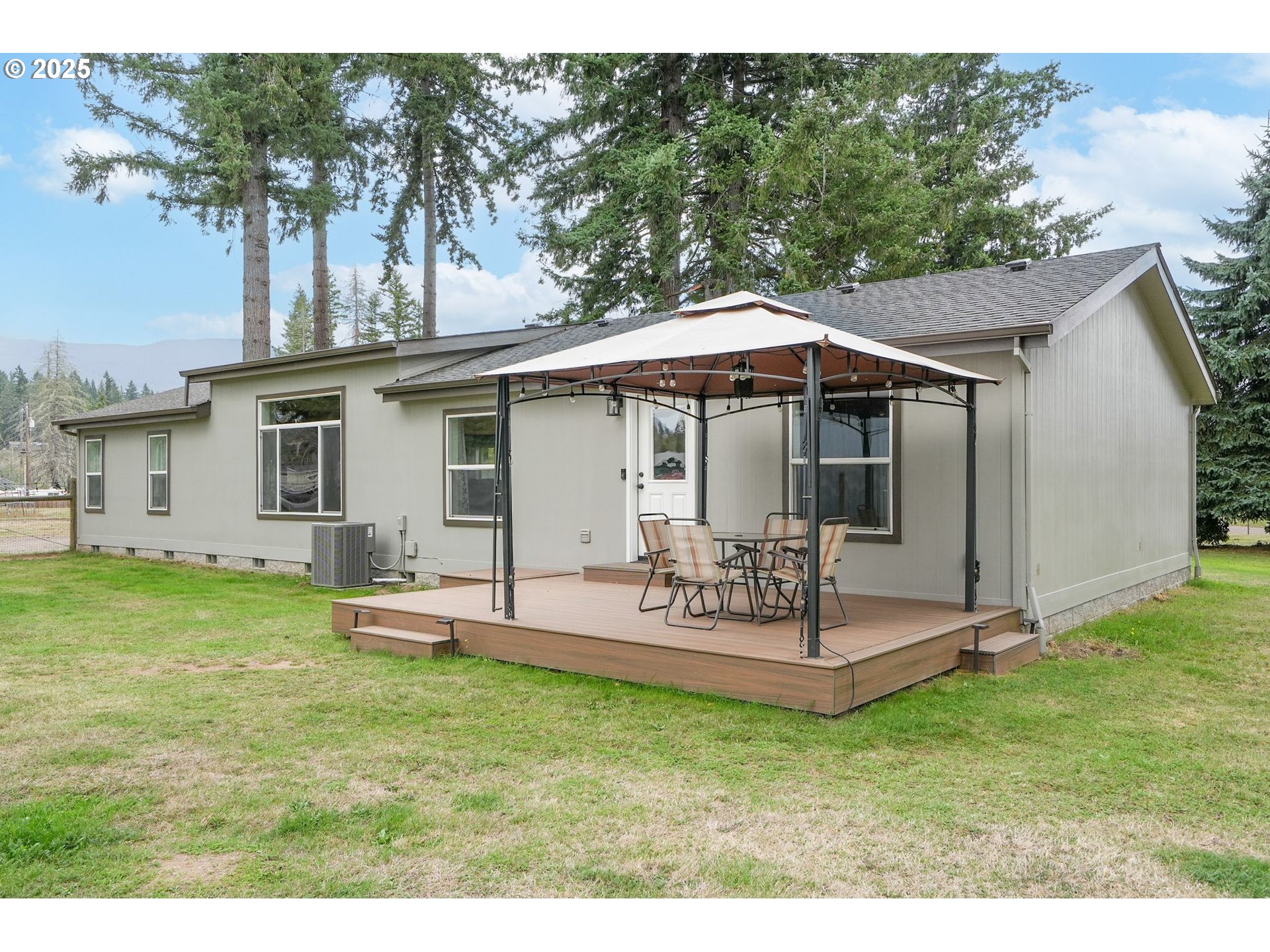 40219 North Dogwood Road Mill City, OR 97360 - Photo 33 of 47 a view of a house with backyard and sitting area