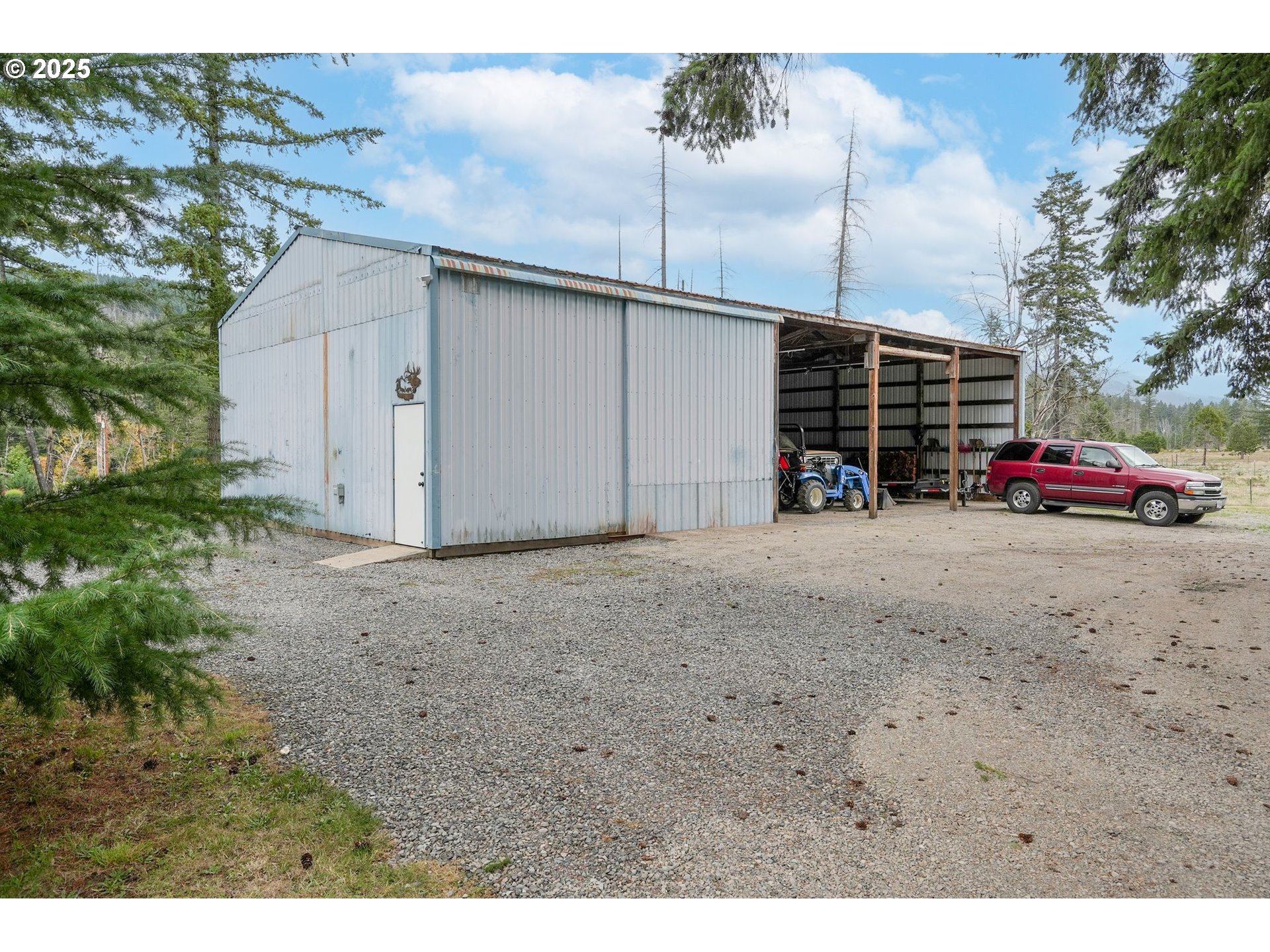 40219 North Dogwood Road Mill City, OR 97360 - Photo 35 of 47 a view of a house with a yard and parking space