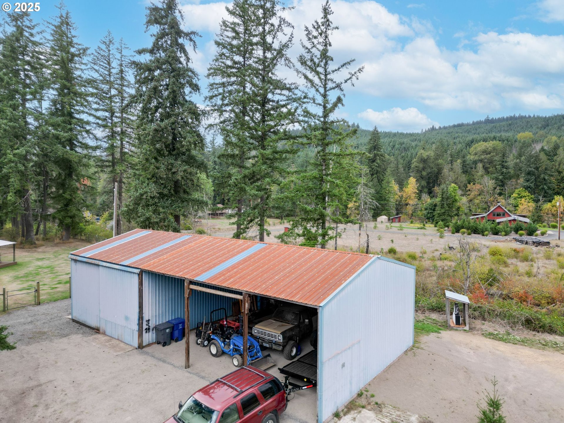 40219 North Dogwood Road Mill City, OR 97360 - Photo 37 of 47 a view of a patio with table and chairs under an umbrella