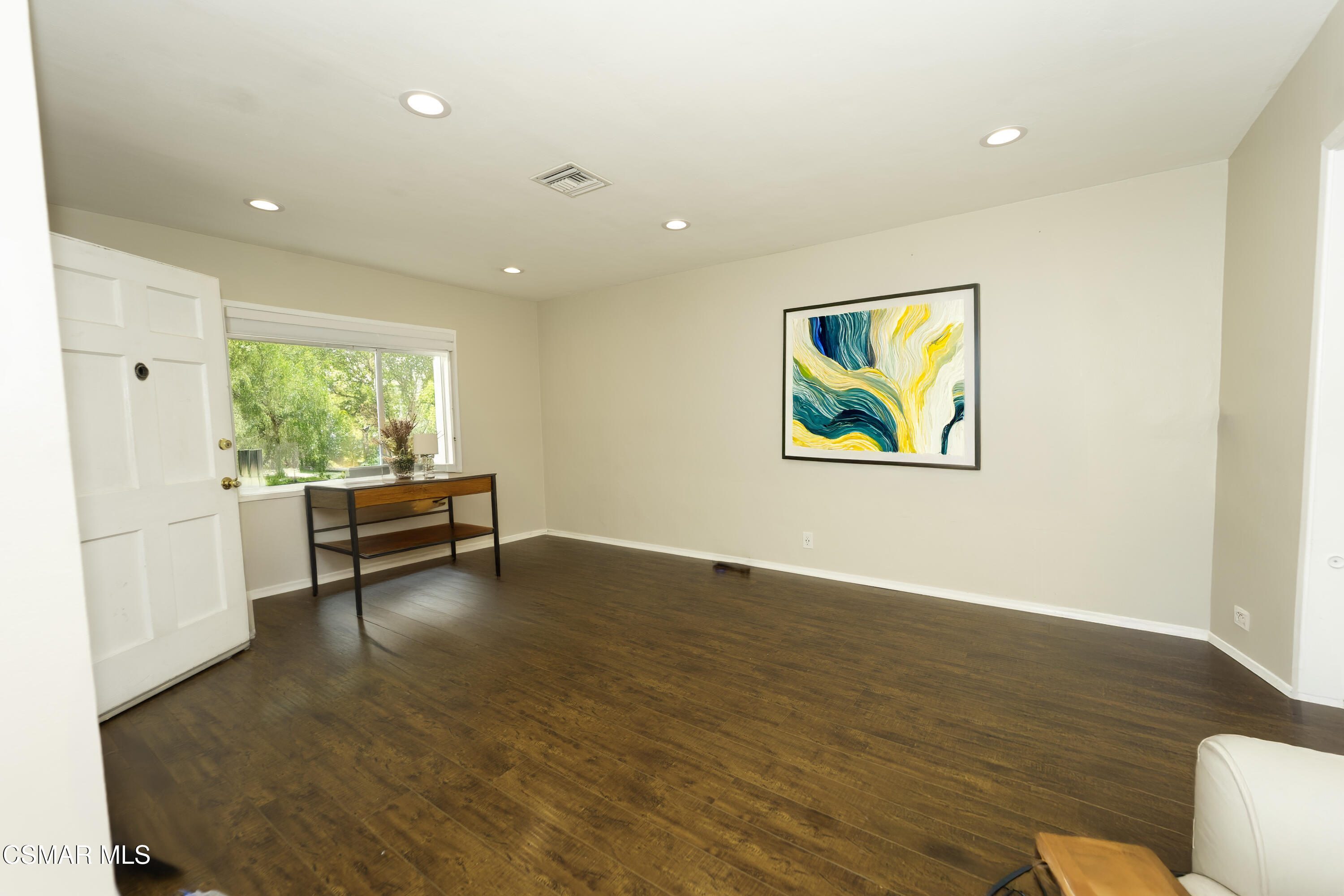5834 Balcom Avenue Encino, CA 91316 - Photo 2 of 10 a view of an empty room with window wooden floor and furniture