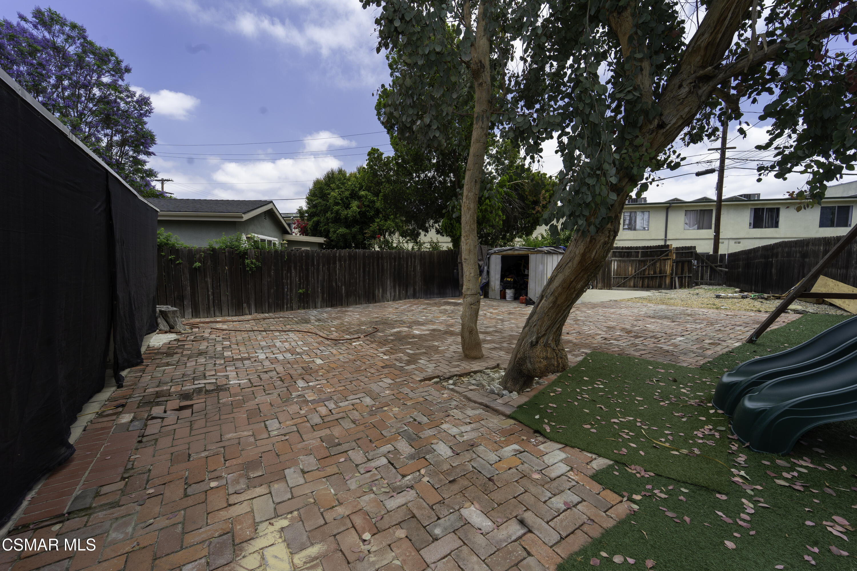 5834 Balcom Avenue Encino, CA 91316 - Photo 8 of 10 a backyard of a house with lots of green space