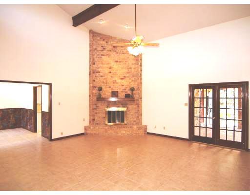 7238 Pepper Ridge Road Corpus Christi, TX 78413 - Photo 2 of 7 a view of a livingroom with a ceiling fan and window