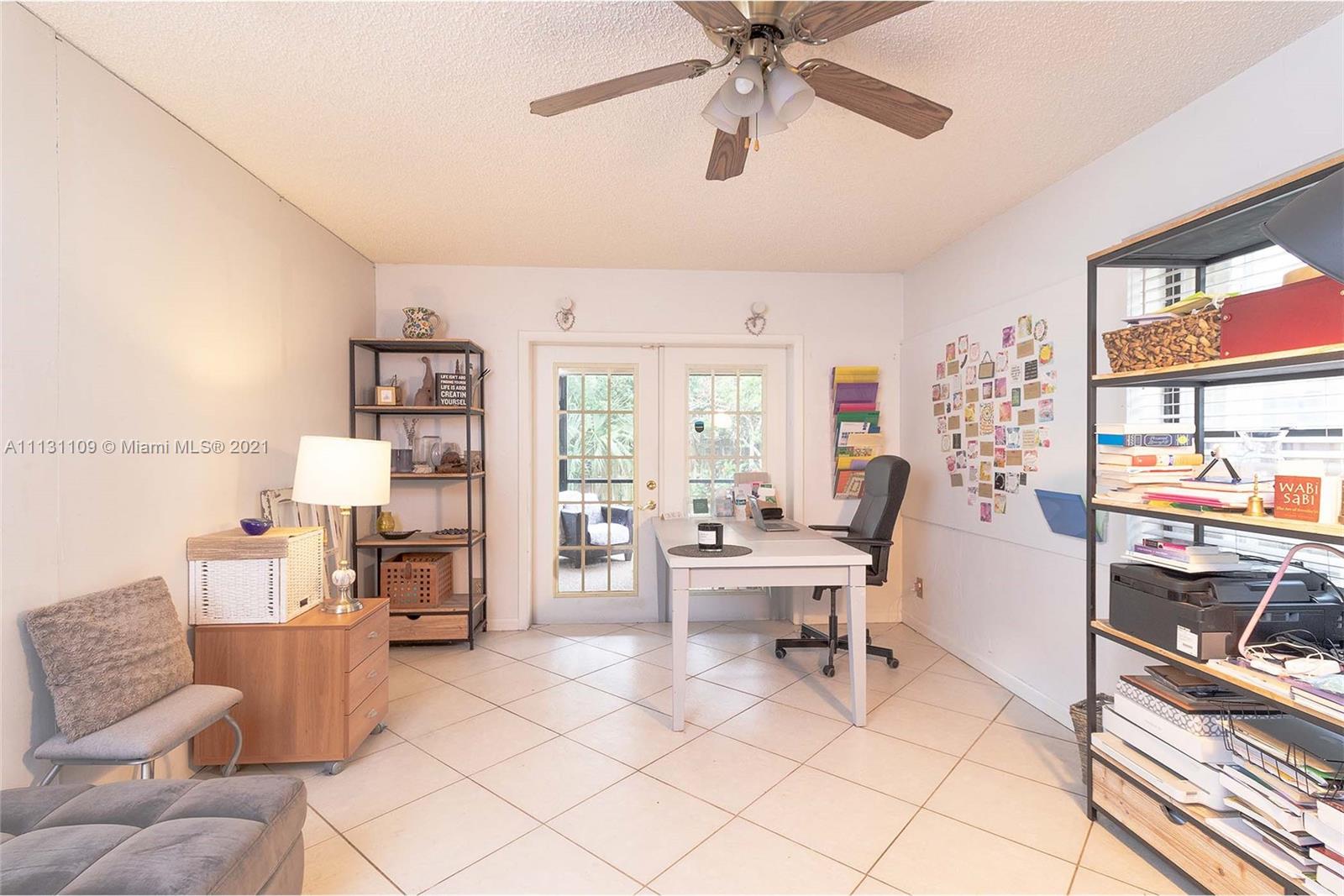 9248 Neptunes Basin Court Boca Raton, FL 33434 - Photo 17 of 34 a living room with furniture and a large window