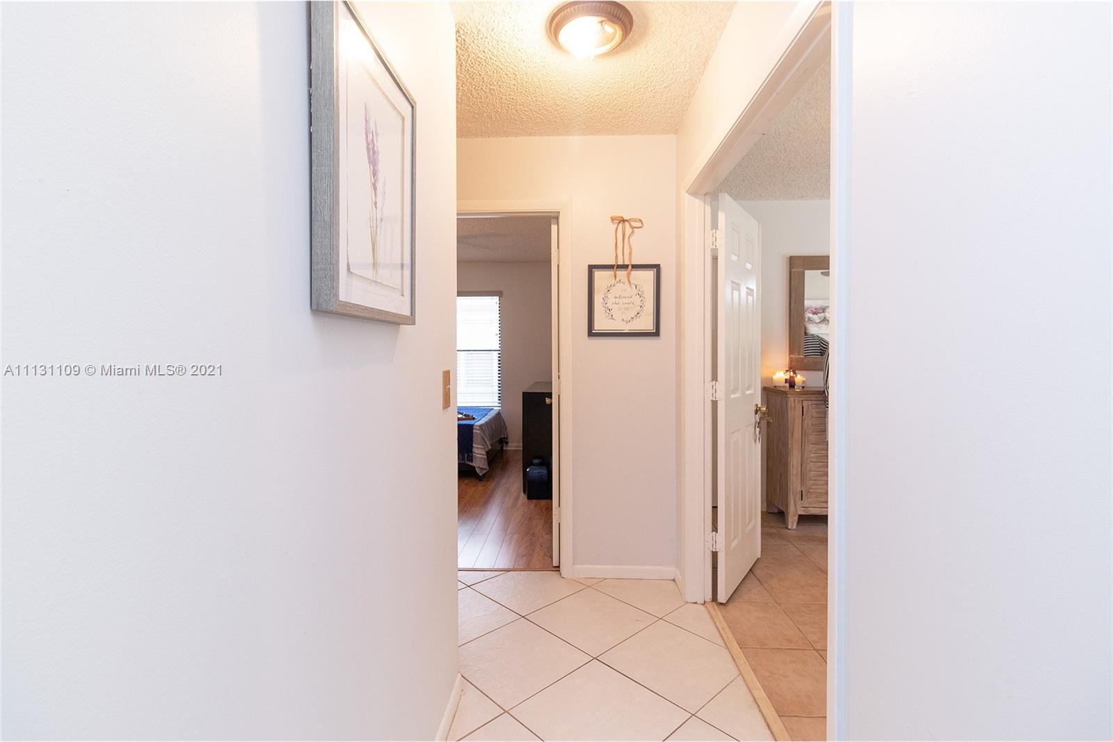 9248 Neptunes Basin Court Boca Raton, FL 33434 - Photo 20 of 34 a view of a hallway with closet
