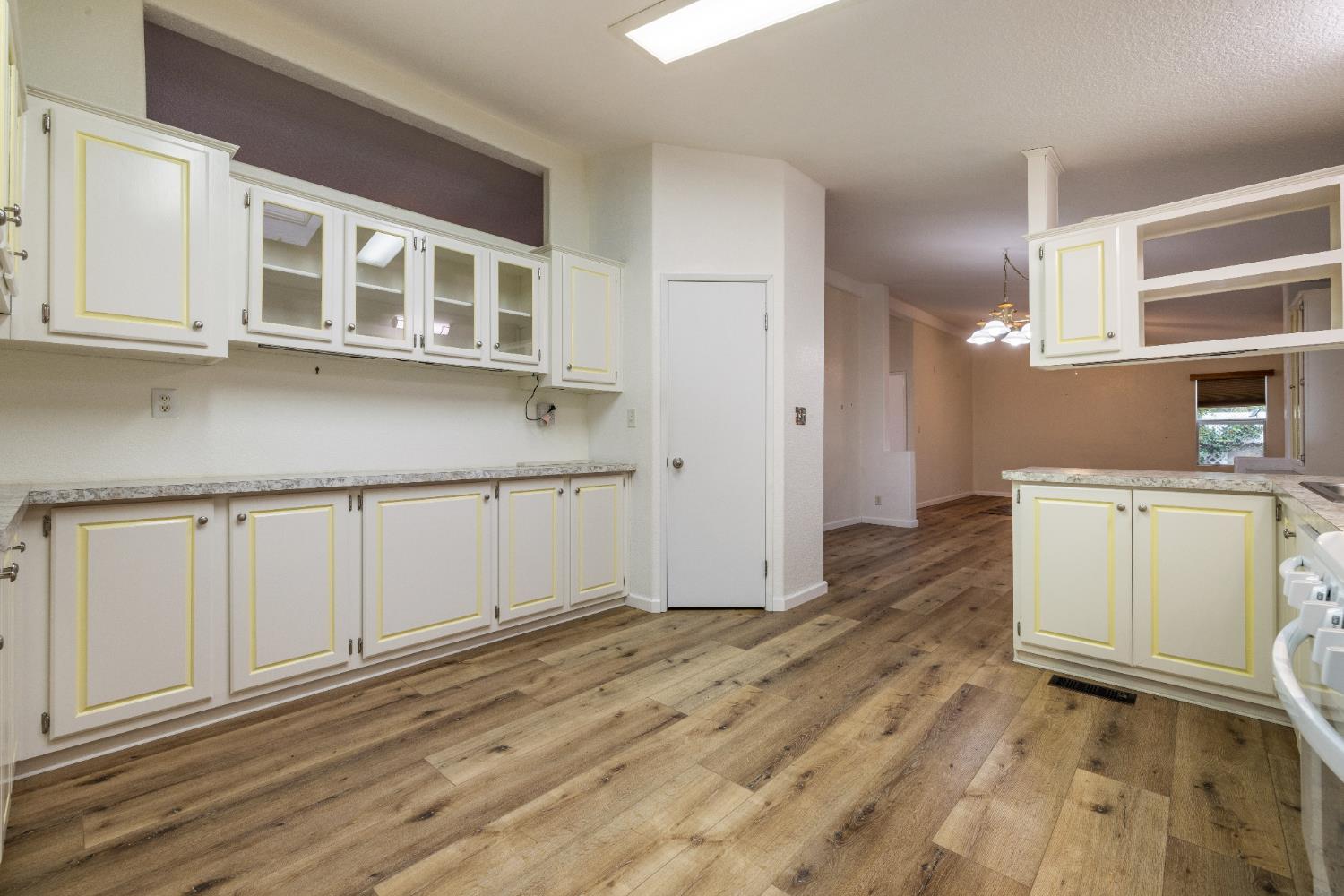 2621 Prescott Road, Unit 87 Modesto, CA 95350 - Photo 15 of 31 a room with a white cabinets and wooden floor