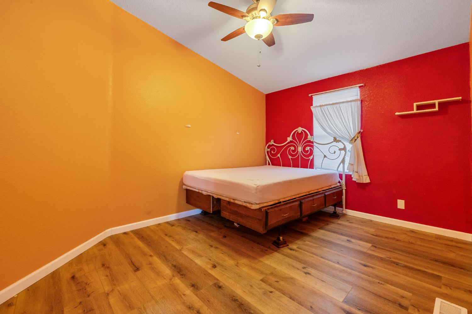 2621 Prescott Road, Unit 87 Modesto, CA 95350 - Photo 21 of 31 a bedroom with a bed and a chandelier