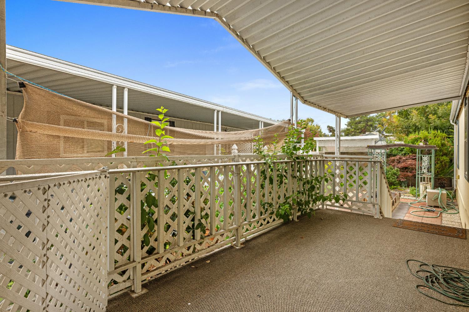 2621 Prescott Road, Unit 87 Modesto, CA 95350 - Photo 4 of 31 a view of outdoor space with wooden deck