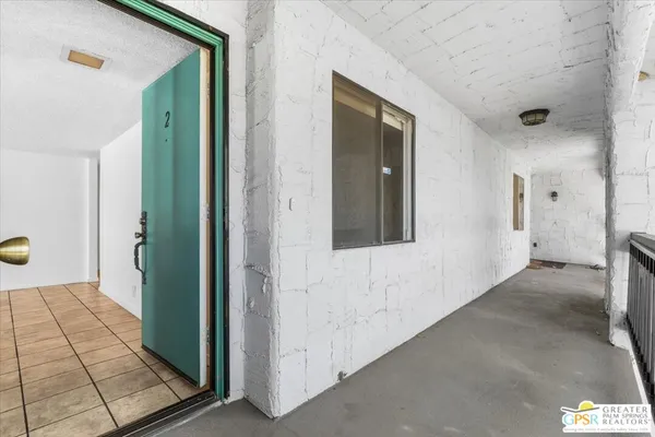 a view of a hallway with a bathroom