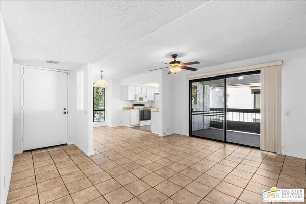 a view of a kitchen with a sink and a living room
