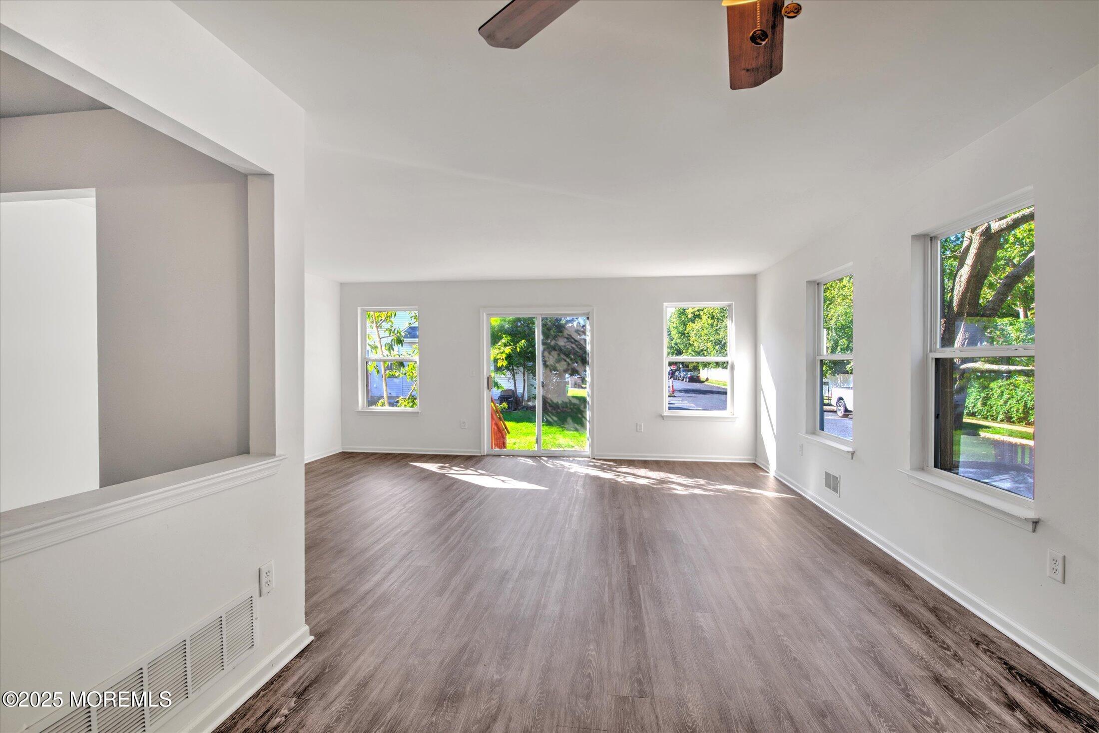 1 Esplanade Way Bayville, NJ 08721 - Photo 14 of 41 a view of an empty room with window and wooden floor