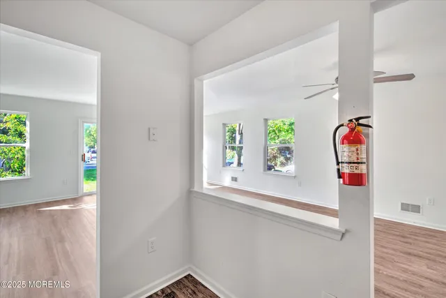 a view of an entryway with wooden floor