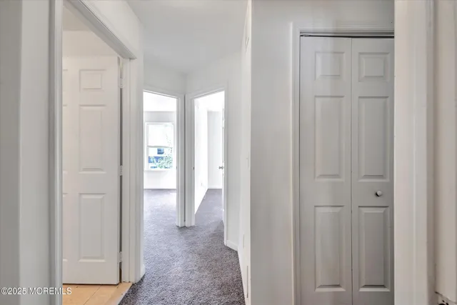 a view of a livingroom from a hallway