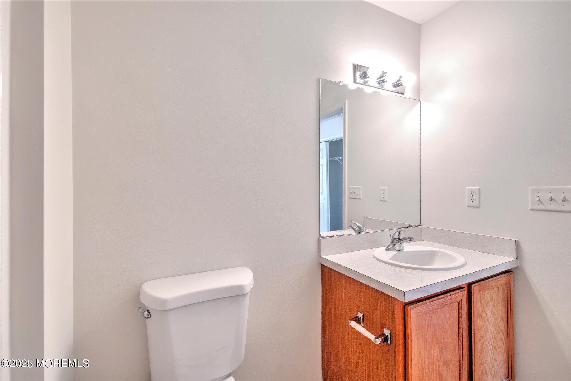 1 Esplanade Way Bayville, NJ 08721 - Photo 28 of 41 a bathroom with a sink and a toilet