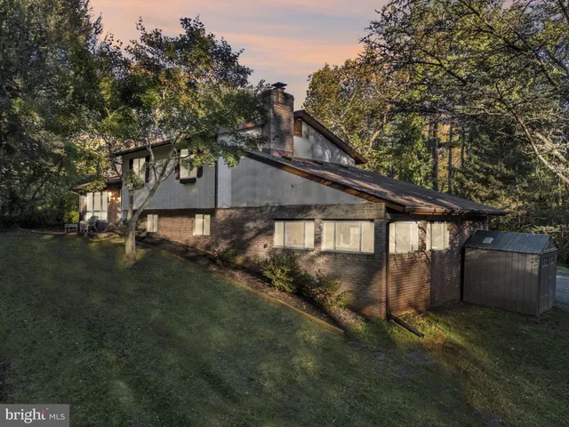 a view of house with outdoor space