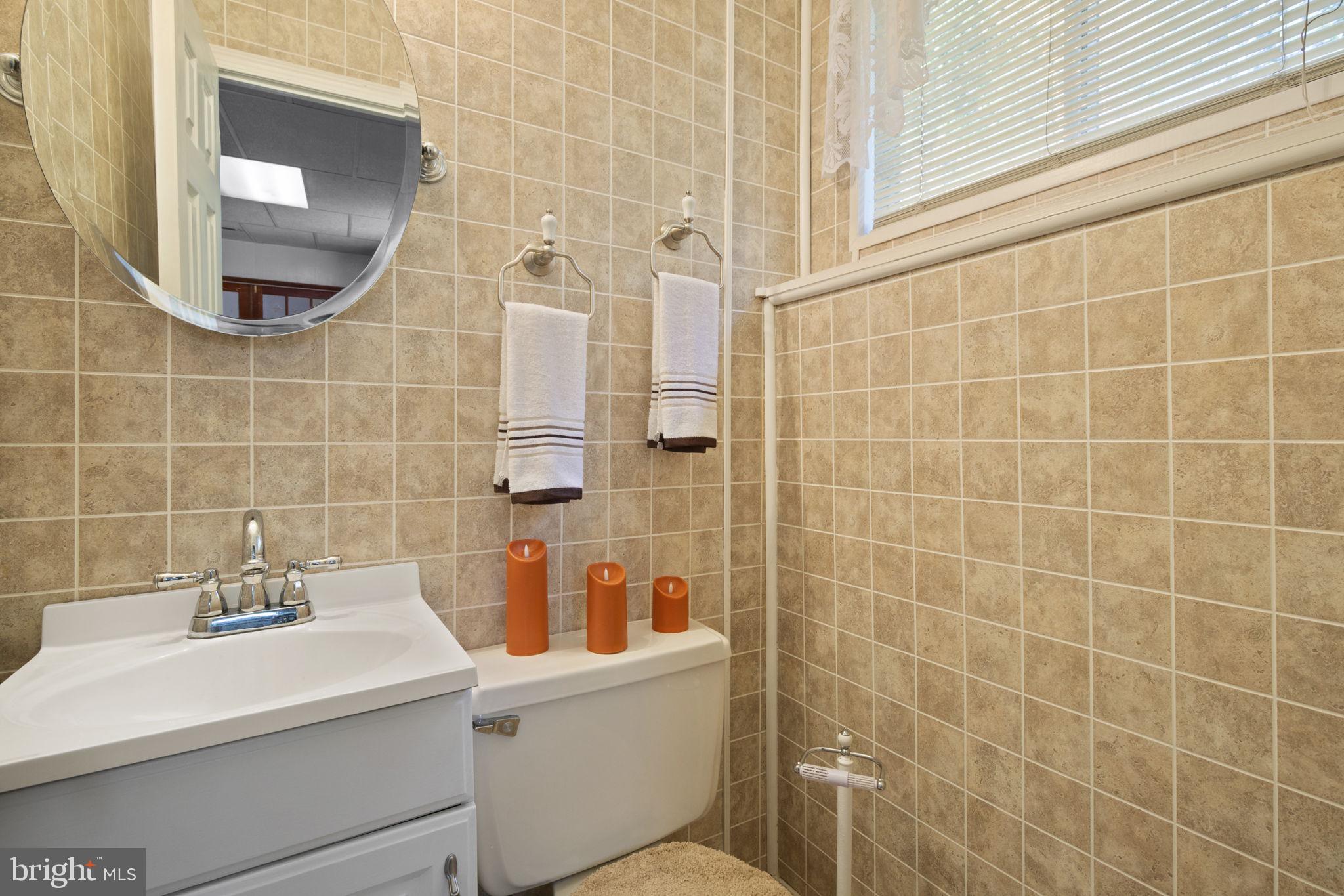1775 Pleasantville Road Forest Hill, MD 21050 - Photo 18 of 35 a bathroom with a sink a toilet and shower