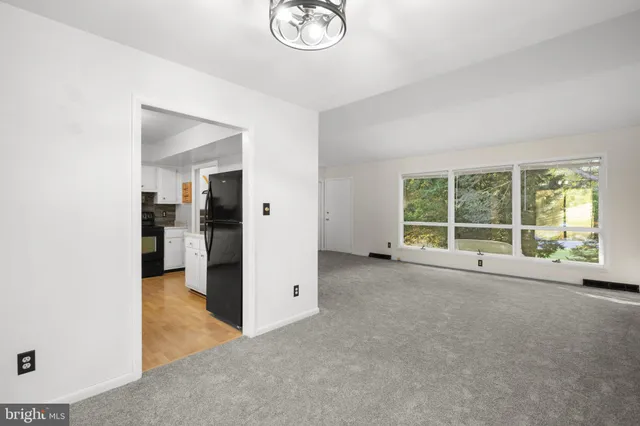 a view of an empty room with a window