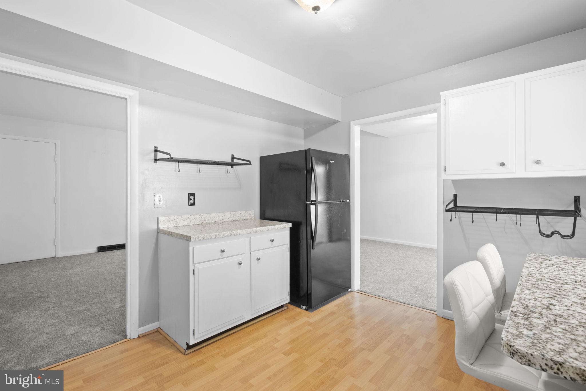 1775 Pleasantville Road Forest Hill, MD 21050 - Photo 8 of 35 a kitchen with cabinets and refrigerator