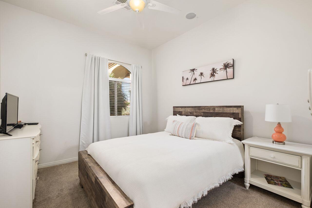 42128 May Pen Road Bermuda Dunes, CA 92203 - Photo 11 of 32 a bedroom with a bed and a flat screen tv