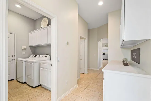 a view of kitchen and utility room with washer and dryer