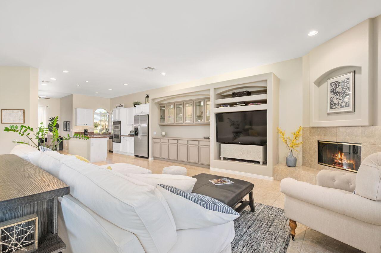 42128 May Pen Road Bermuda Dunes, CA 92203 - Photo 21 of 32 a living room with furniture fireplace and flat screen tv