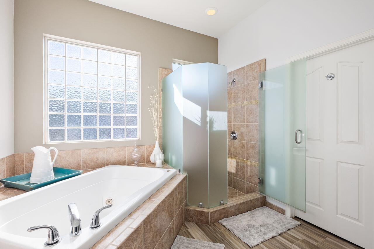 42128 May Pen Road Bermuda Dunes, CA 92203 - Photo 24 of 32 a bathroom with a tub a sink and a window
