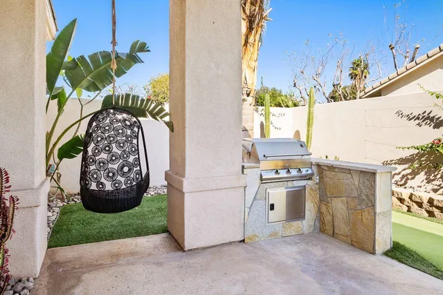 a kitchen with a refrigerator and a stove