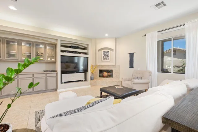 a bedroom with a bed window and couch