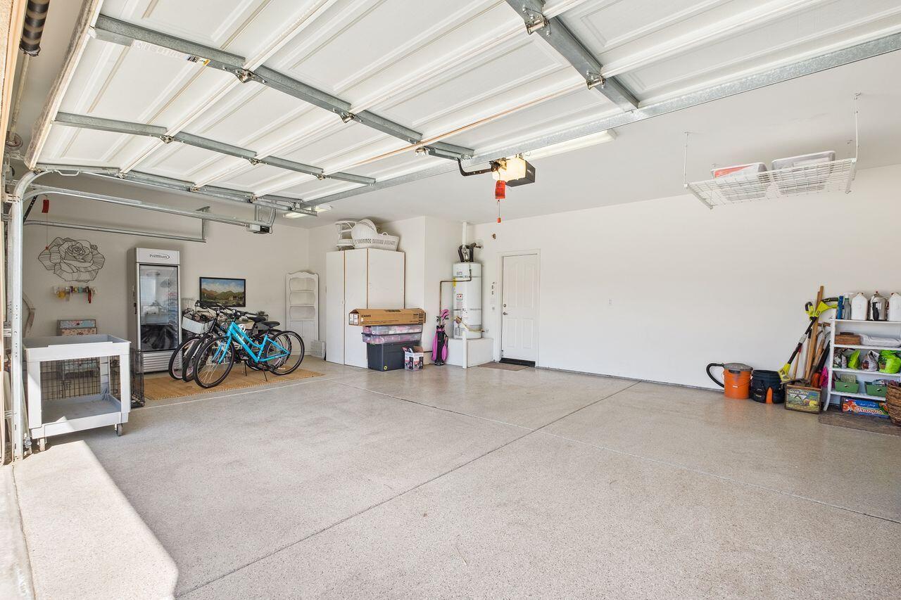 42128 May Pen Road Bermuda Dunes, CA 92203 - Photo 31 of 32 a view of a garage with furniture and a car parked
