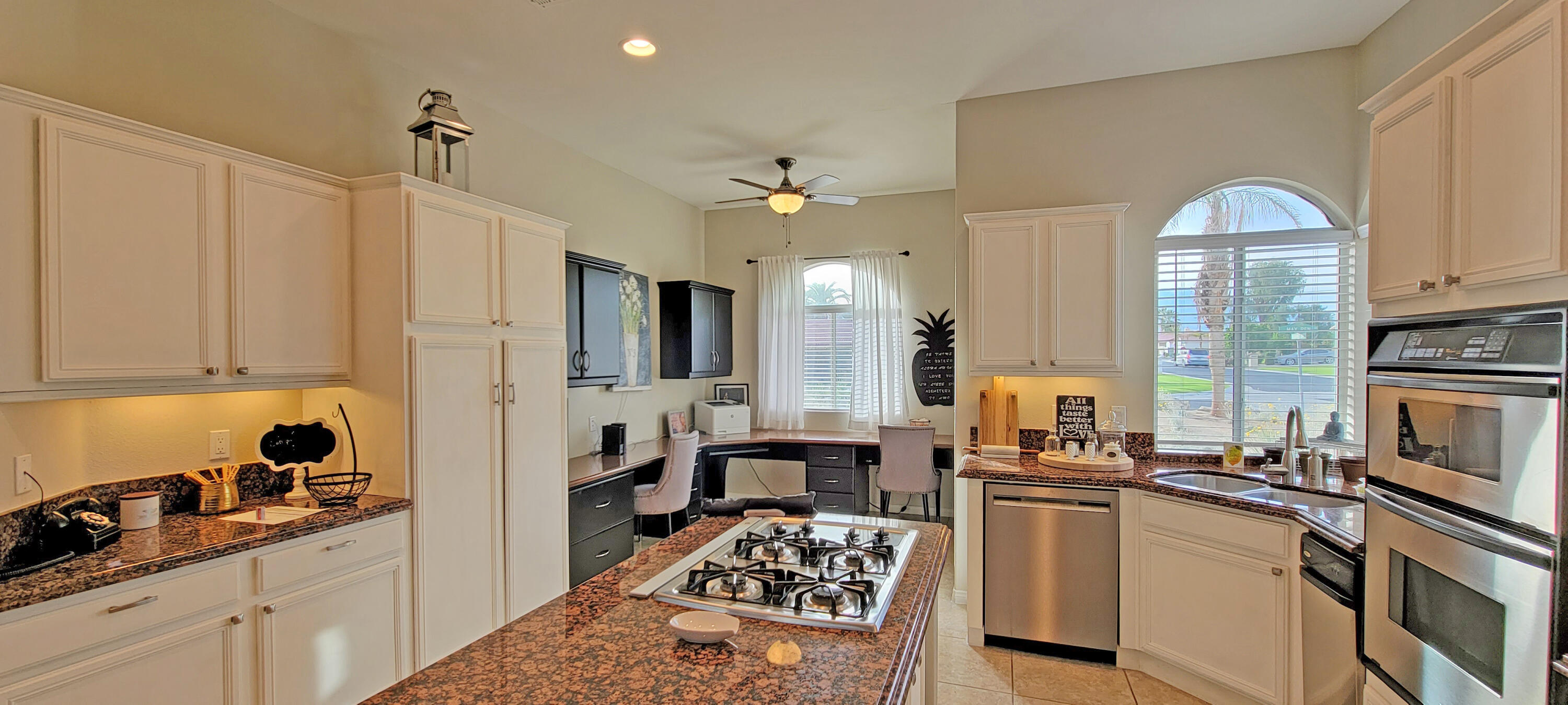 42128 May Pen Road Bermuda Dunes, CA 92203 - Photo 5 of 32 a kitchen with a sink stove and refrigerator