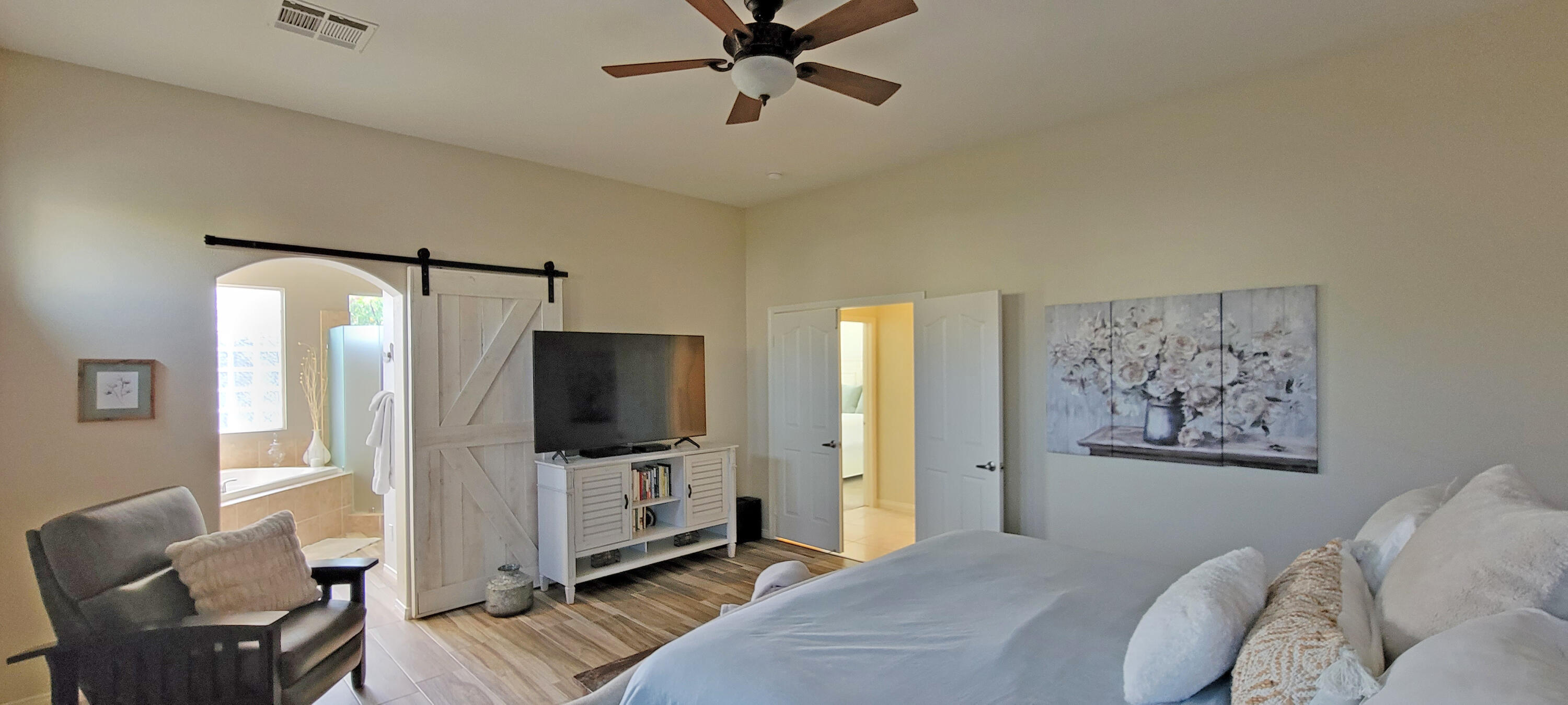 42128 May Pen Road Bermuda Dunes, CA 92203 - Photo 7 of 32 a bedroom with a bed window and a television