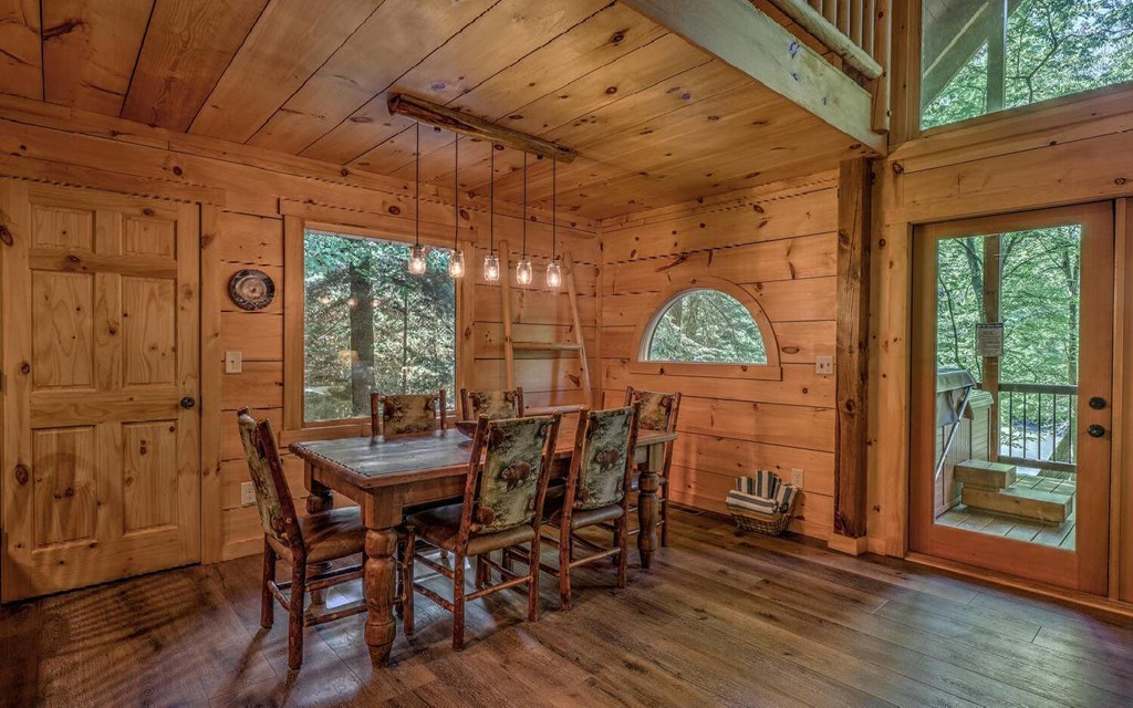 343 Muller Lane Ellijay, GA 30540 - Photo 14 of 35 a view of a dining room with furniture window and wooden floor