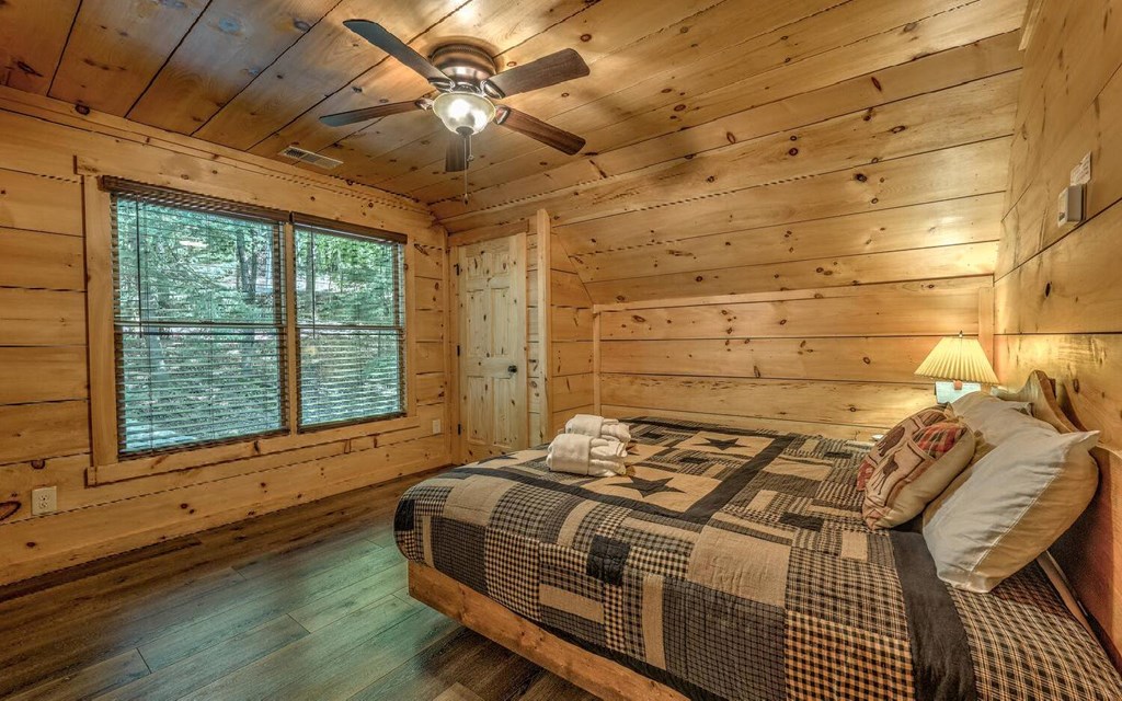 343 Muller Lane Ellijay, GA 30540 - Photo 24 of 35 a bedroom with a bed and a window