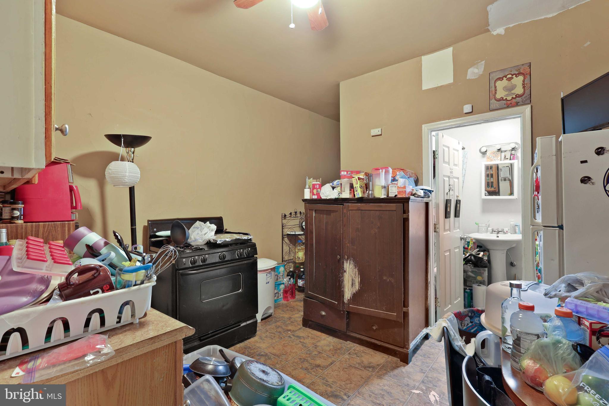 3955 Greenmount Avenue Baltimore, MD 21218 - Photo 15 of 42 Main level kit looking into full bathroom