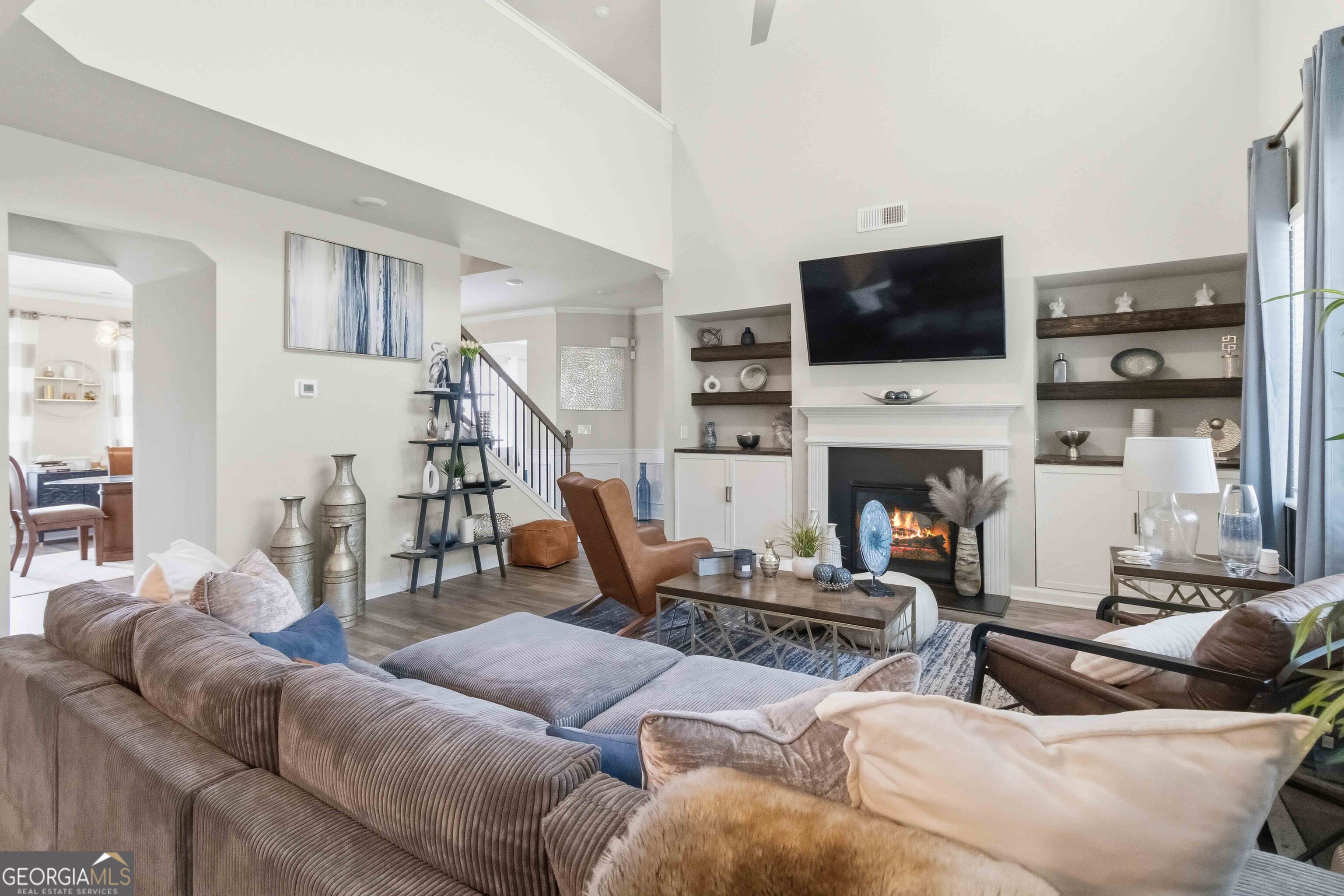 386 Paden Way Jonesboro, GA 30238 - Photo 11 of 29 a living room with furniture a flat screen tv and a fireplace