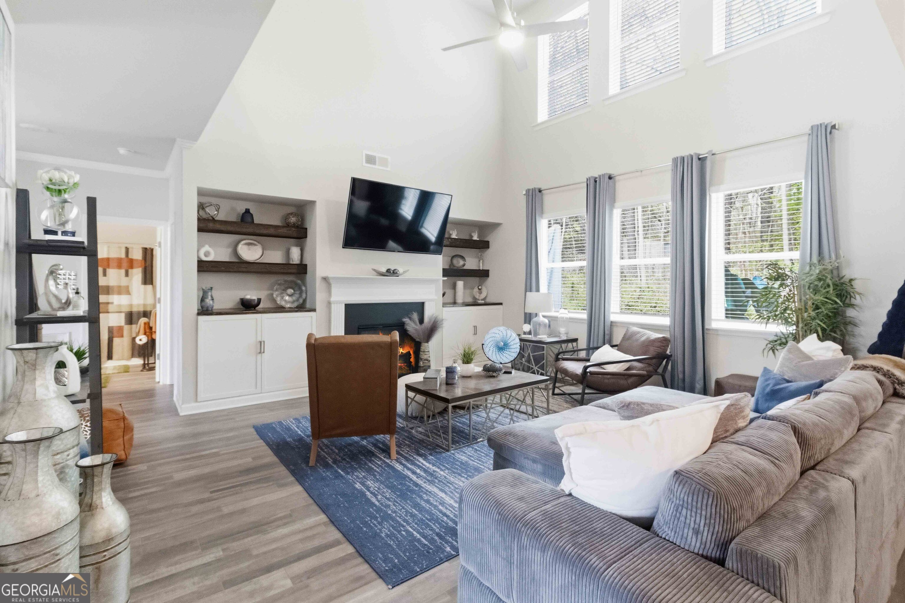 386 Paden Way Jonesboro, GA 30238 - Photo 12 of 29 a living room with furniture fireplace and a flat screen tv