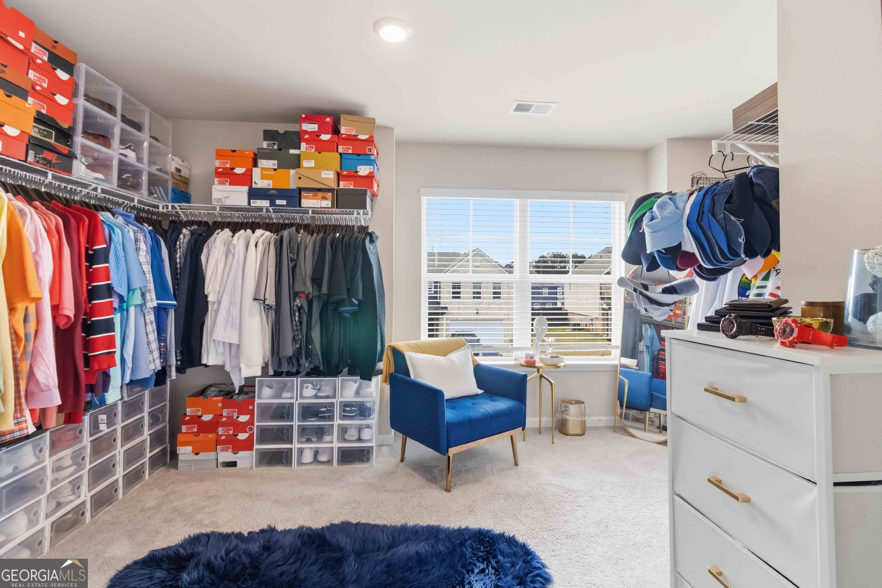 386 Paden Way Jonesboro, GA 30238 - Photo 18 of 29 a view of walk in closet with clothes and shoes