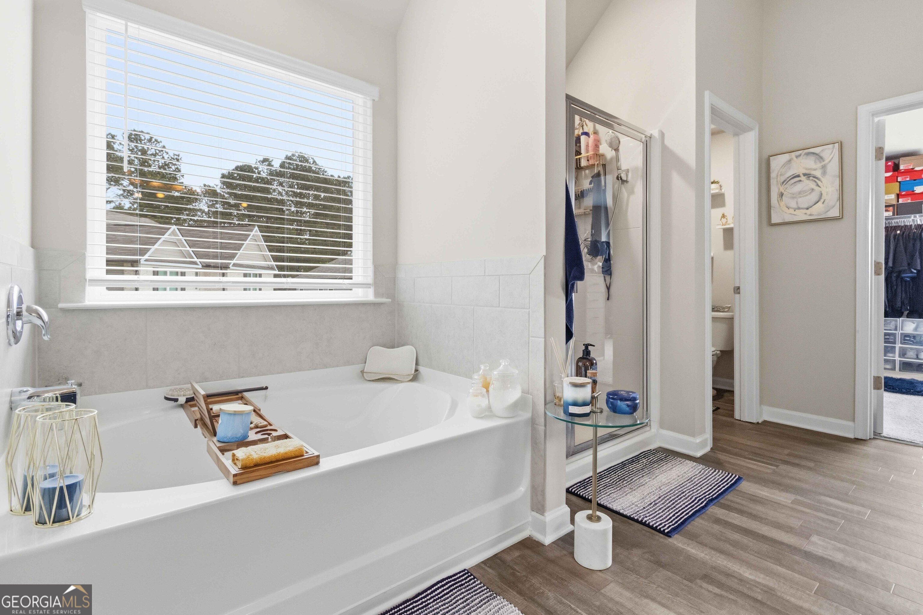 386 Paden Way Jonesboro, GA 30238 - Photo 19 of 29 a bathroom with a tub sink and a window