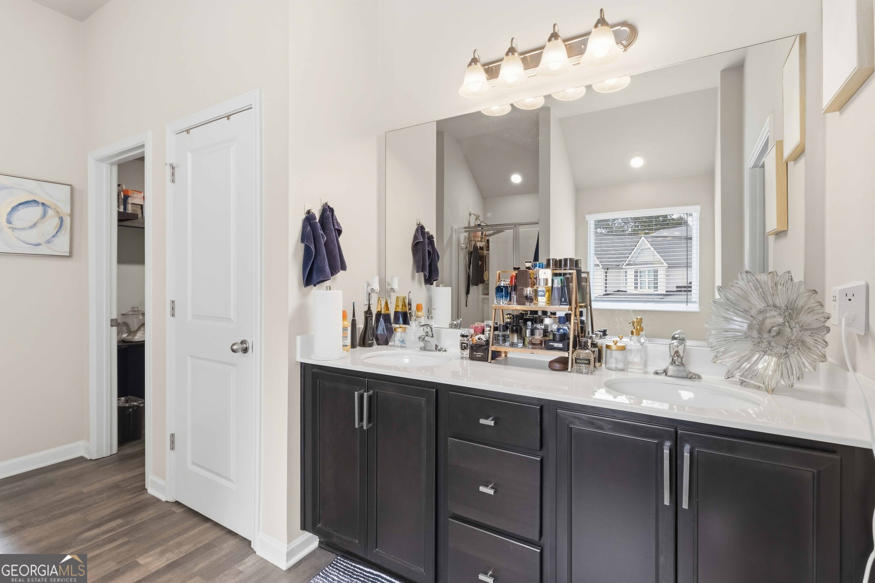 386 Paden Way Jonesboro, GA 30238 - Photo 20 of 29 a bathroom with a double vanity sink and a mirror