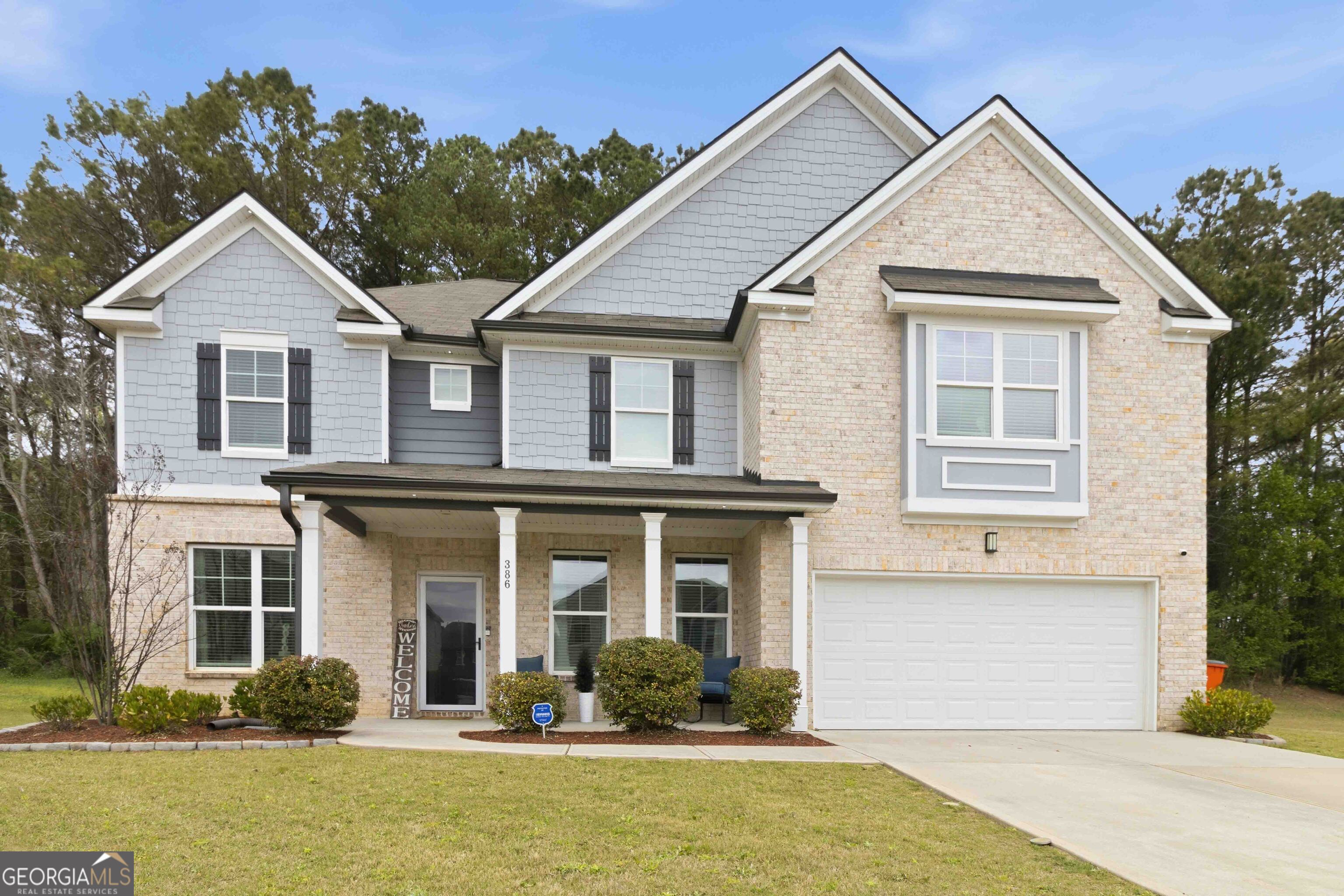 386 Paden Way Jonesboro, GA 30238 - Photo 2 of 29 a front view of a house with a yard