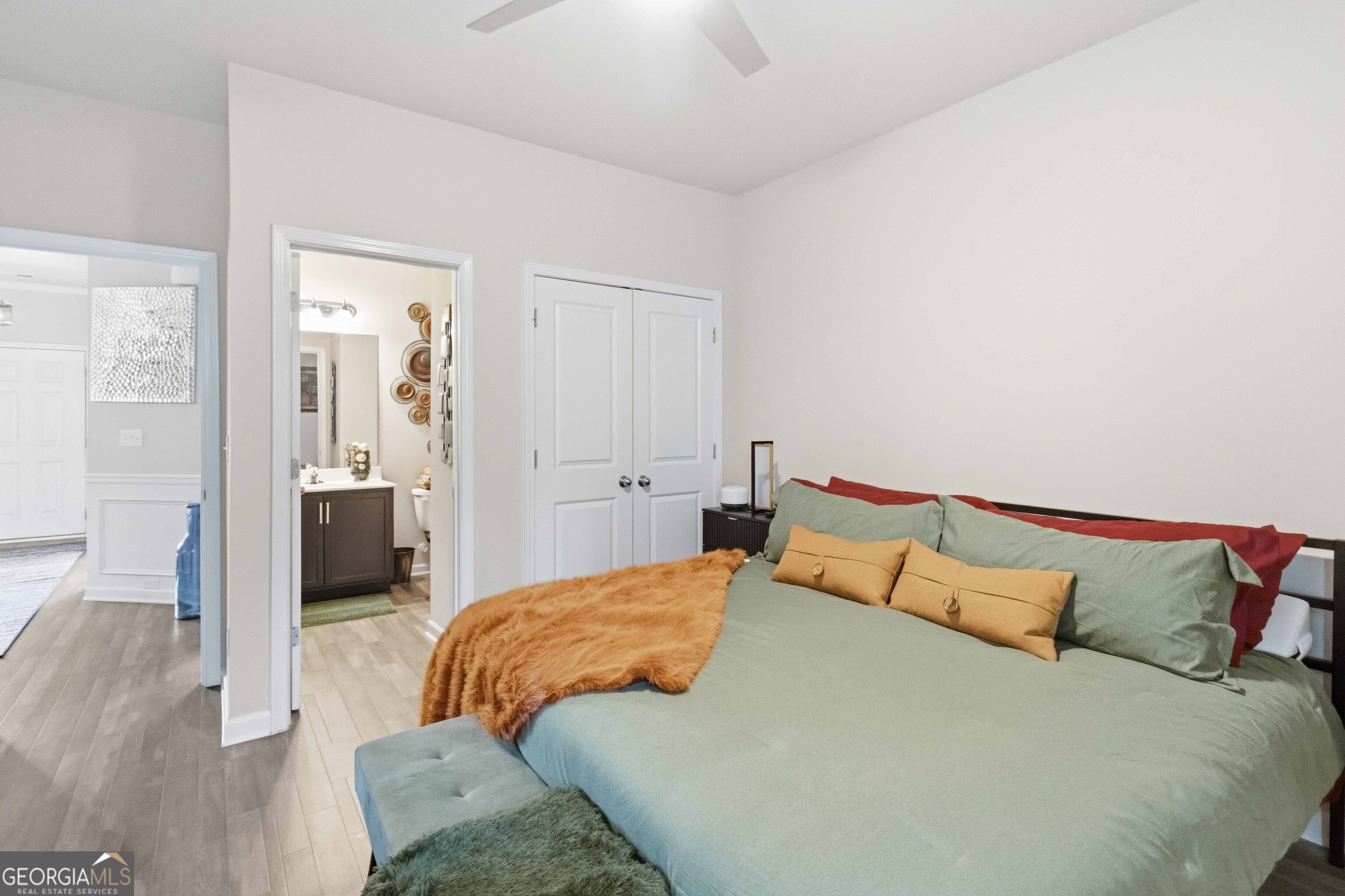 386 Paden Way Jonesboro, GA 30238 - Photo 21 of 29 a bedroom with a bed and wooden floor