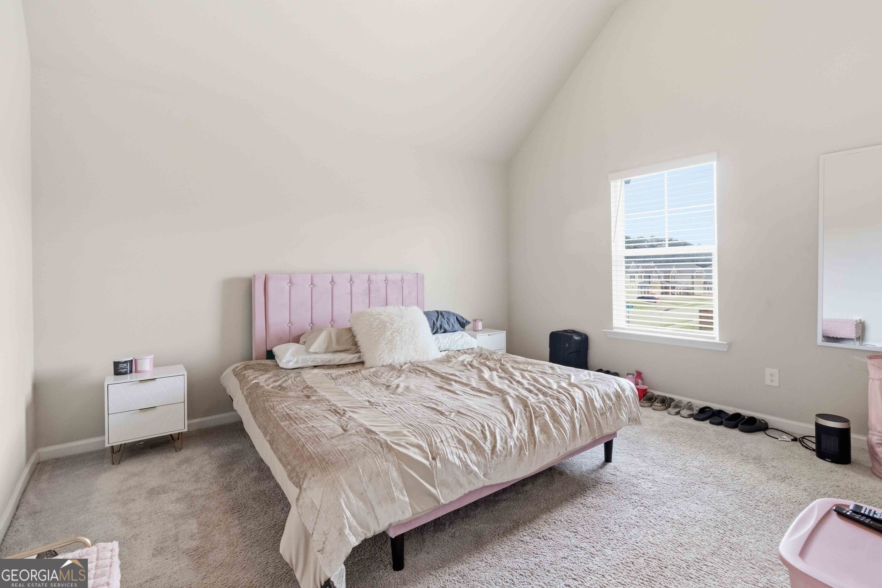 386 Paden Way Jonesboro, GA 30238 - Photo 23 of 29 a bedroom with a bed and a window