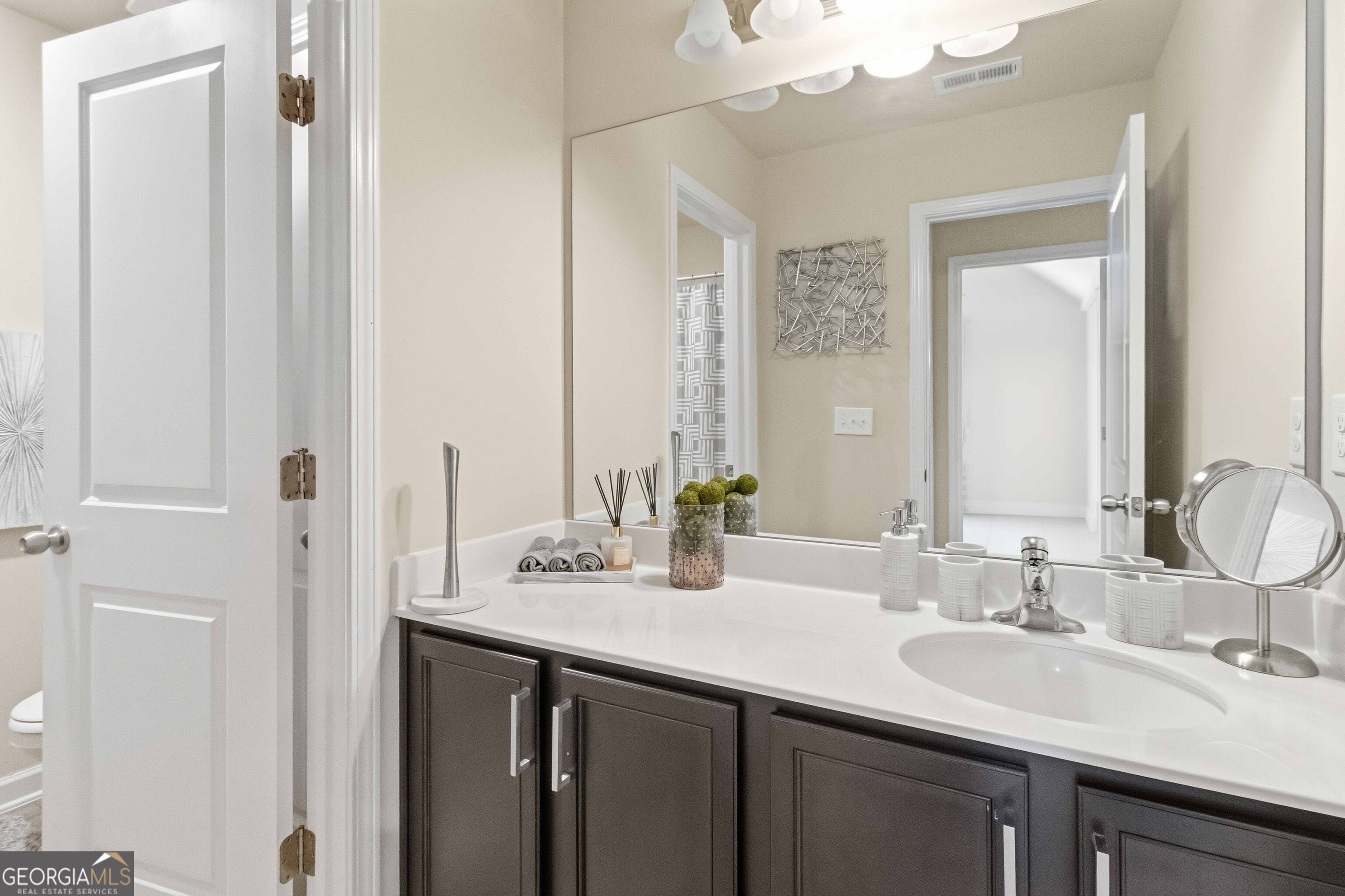 386 Paden Way Jonesboro, GA 30238 - Photo 27 of 29 a bathroom with double sink and a mirror