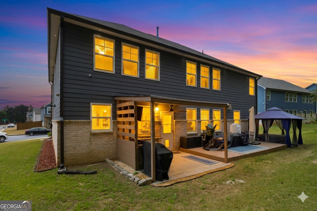 386 Paden Way Jonesboro, GA 30238 - Photo 29 of 29 a view of a backyard with plants and a patio