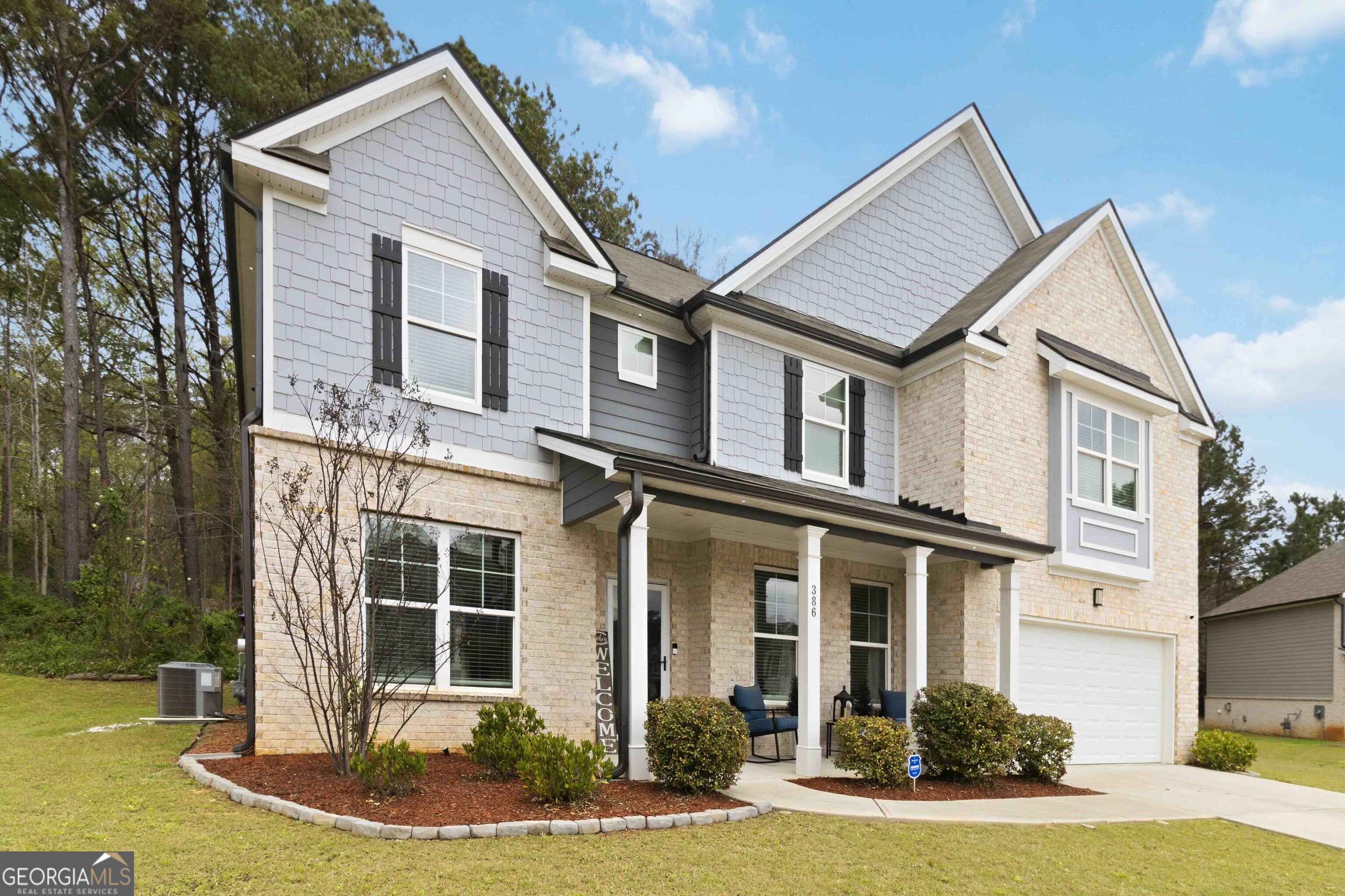 386 Paden Way Jonesboro, GA 30238 - Photo 3 of 29 a front view of a house with a yard