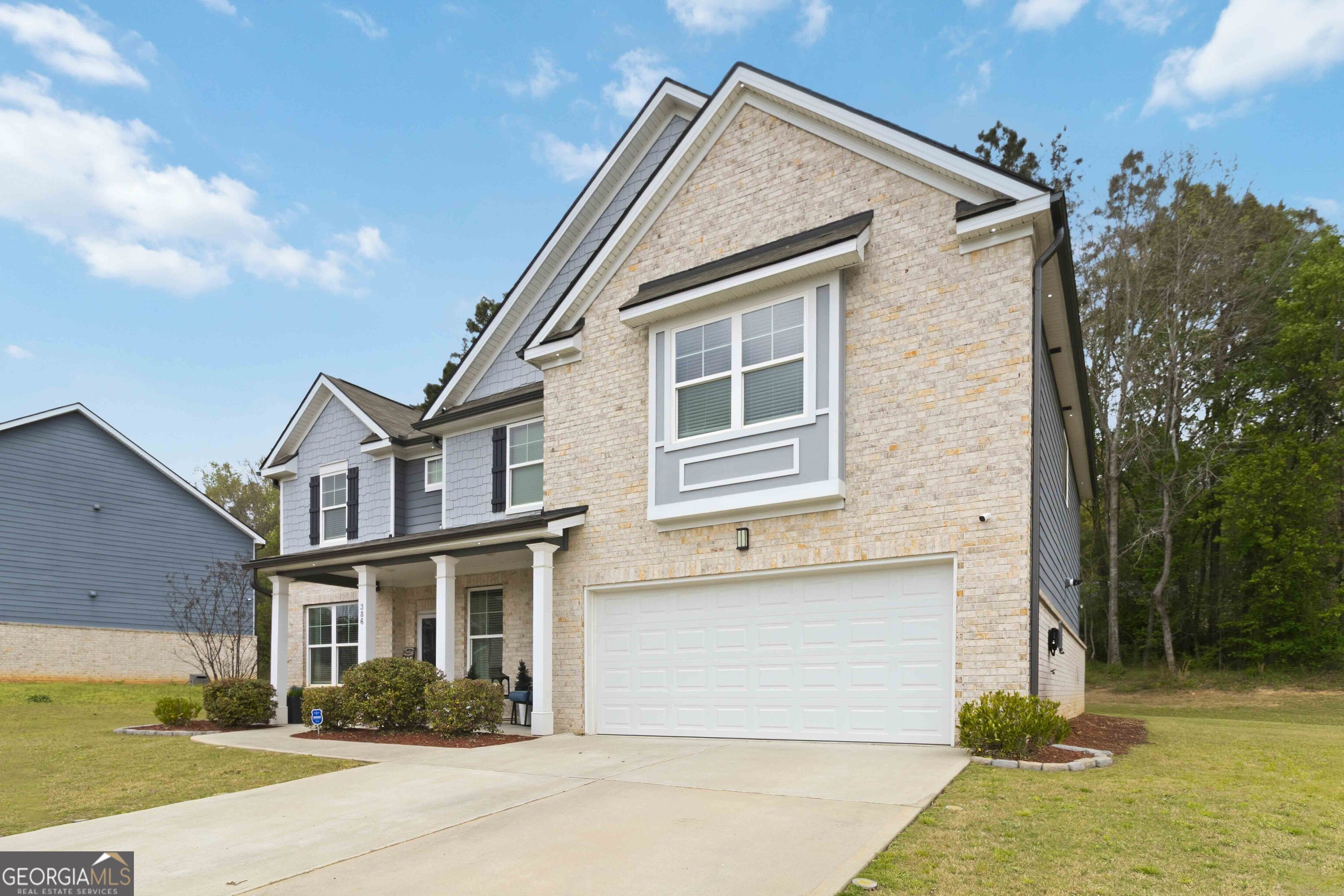 386 Paden Way Jonesboro, GA 30238 - Photo 4 of 29 a front view of a house with a yard