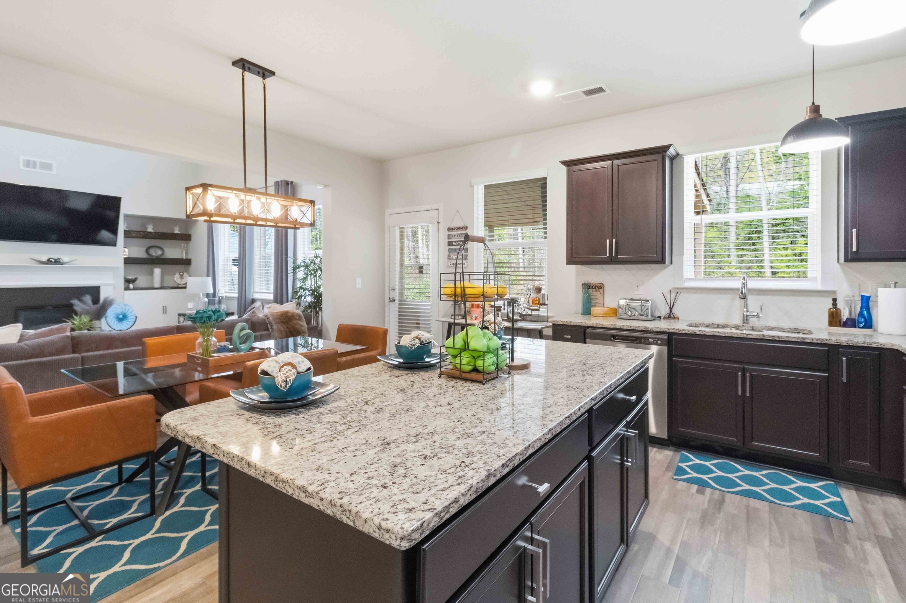 386 Paden Way Jonesboro, GA 30238 - Photo 8 of 29 a kitchen with sink a window and chairs