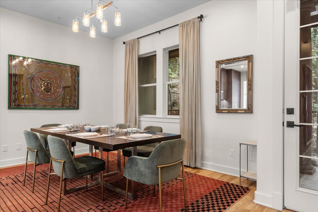 1529 Barton Springs Road, Unit 27 Austin, TX 78704 - Photo 39 of 40 This naturally illuminated dining room offers ample space for entertaining, featuring elegant window treatments.