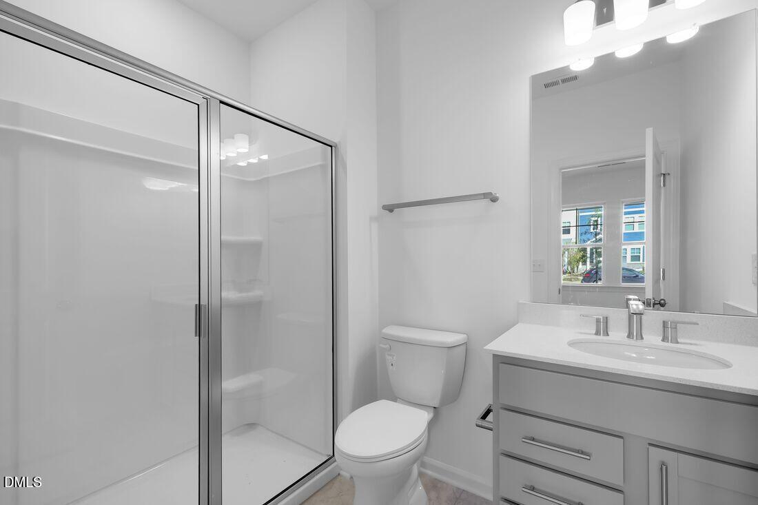 430 Rowe Way Knightdale, NC 27545 - Photo 4 of 51 a bathroom with a granite countertop sink toilet and shower