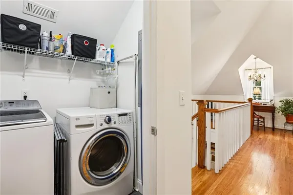 a view of storage and utility room with washer and dryer